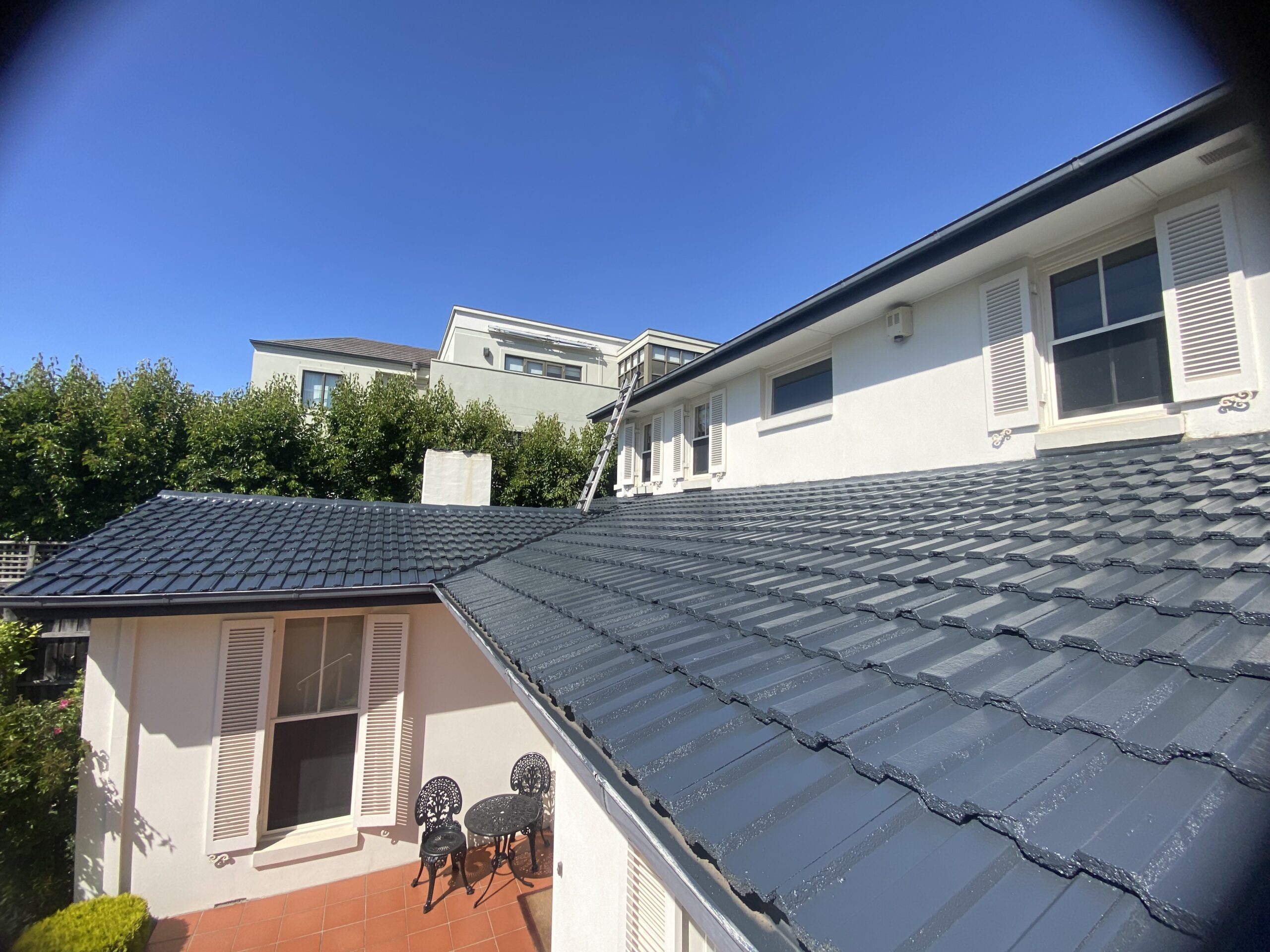 Restored charcoal tile roof overlooking the courtyard of the Ringwood home