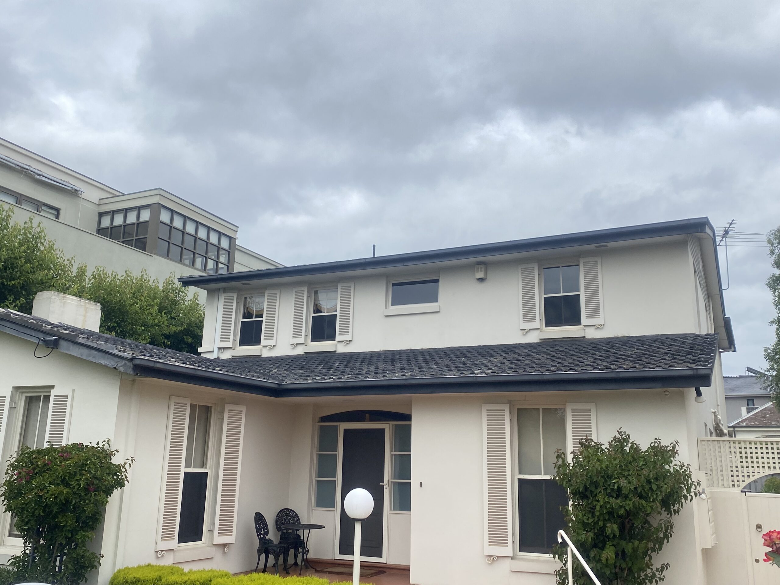 Weathered concrete tile roof before restoration in Ringwood